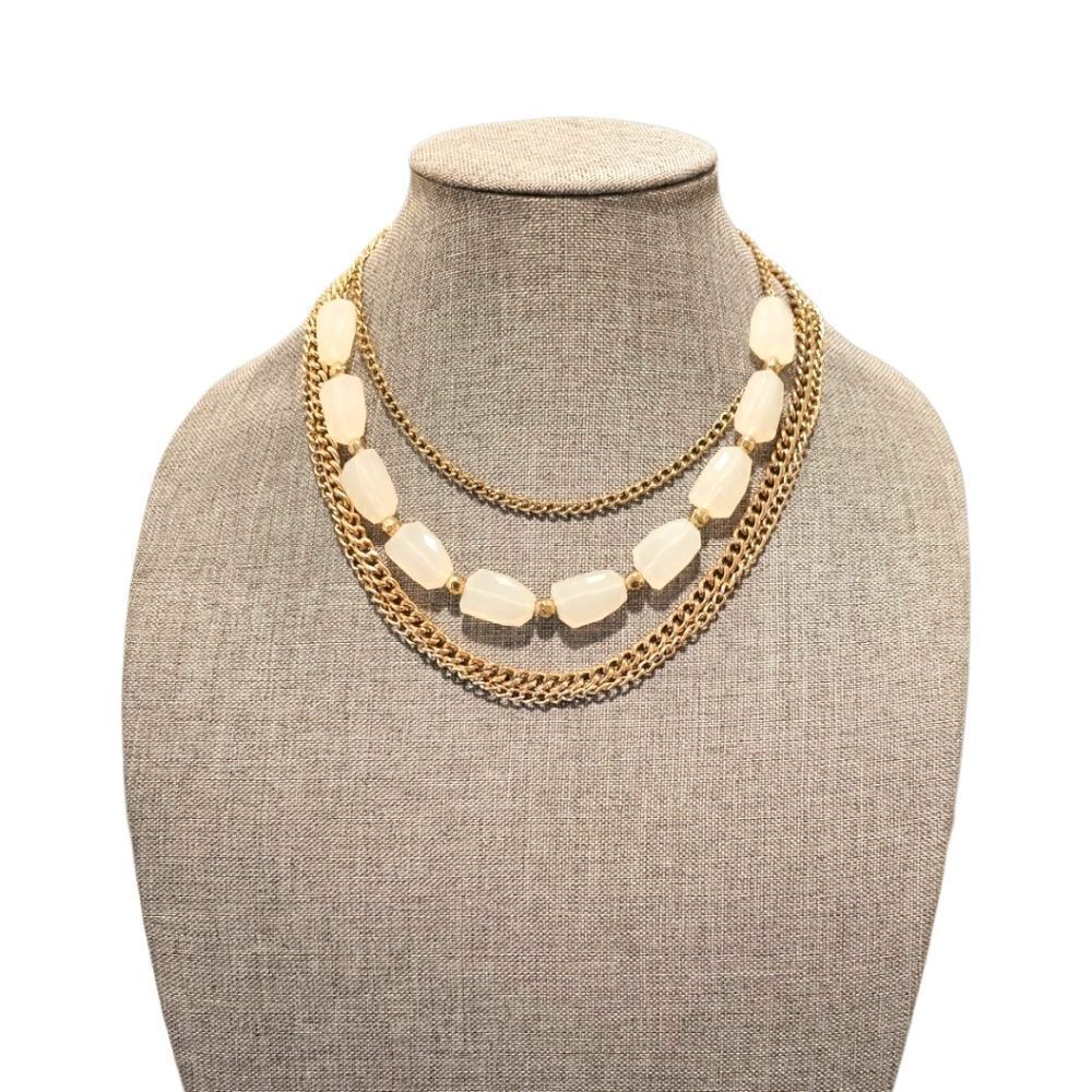 Sophia's Golden Elegance: A Four-Layered White Stone Bead Statement Necklace